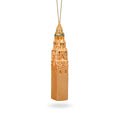 Gold-colored tower ornament on a white background