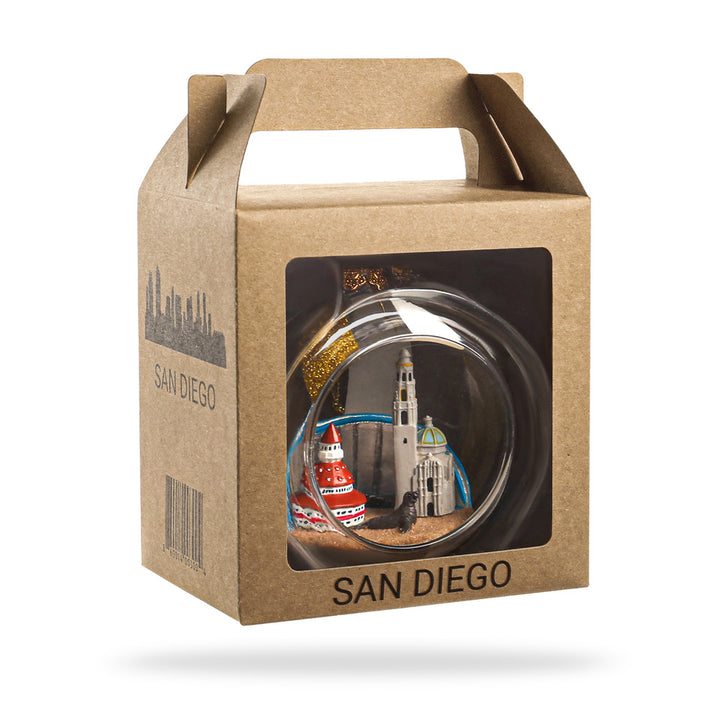 Decorative item in a clear ball with a cityscape inside, displayed in a 'San Diego' branded box.