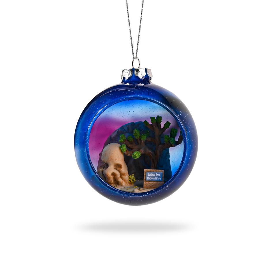 Joshua Tree National Park Glass Globe Ornament by Local Elves featuring Skull Rock and Milky Way night sky from the front