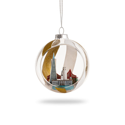 Sparkling glass SF Globe Ornament with glitter detail, showcasing iconic San Francisco landmarks inside a festive holiday globe.